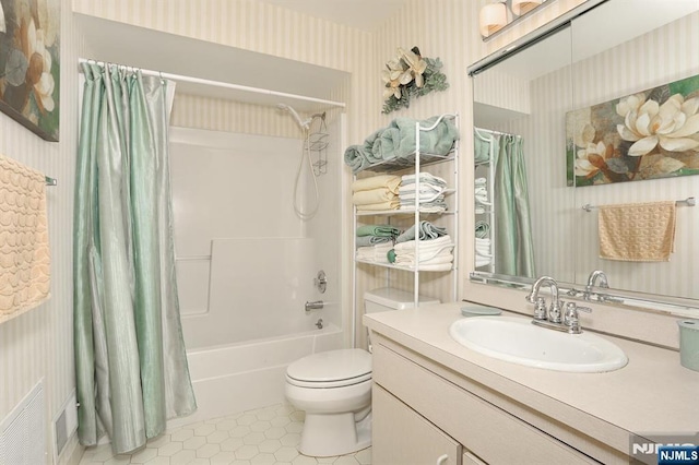 bathroom featuring vanity, tile patterned floors, toilet, wallpapered walls, and shower / tub combo with curtain