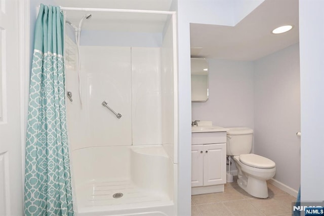 bathroom featuring curtained shower, baseboards, toilet, vanity, and tile patterned flooring