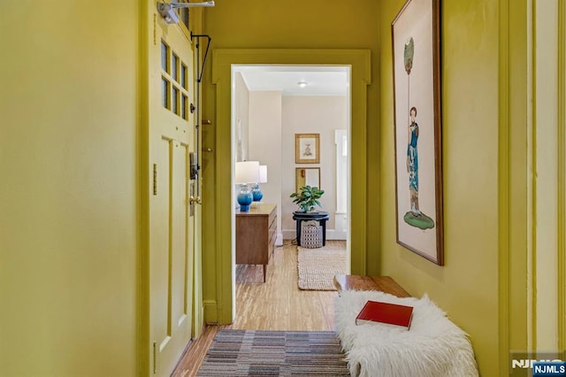 hall with wood finished floors