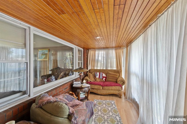 sunroom / solarium with wooden ceiling and wood finished floors