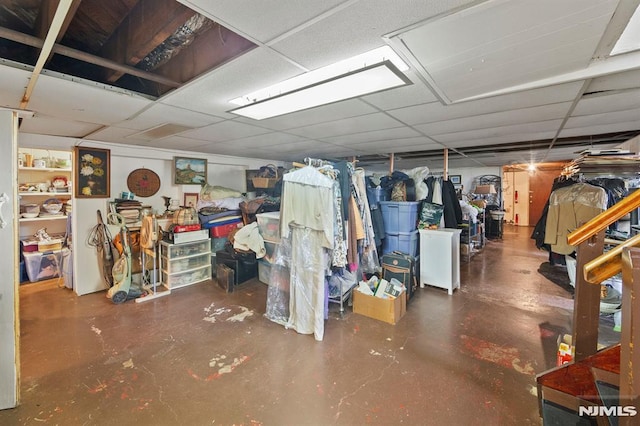 finished basement featuring a drop ceiling