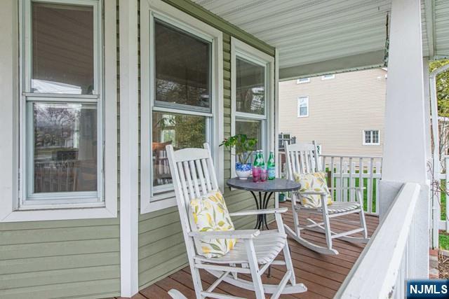 wooden terrace featuring a porch