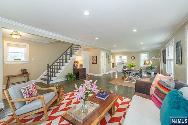 living room featuring recessed lighting, wood finished floors, stairs, baseboards, and crown molding