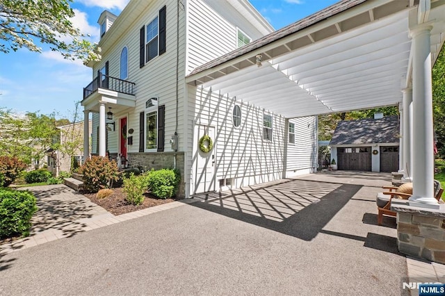322 Maple St, Ramsey, NJ 07446 - view of patio / terrace with an outbuilding, aphalt driveway, and a balcony