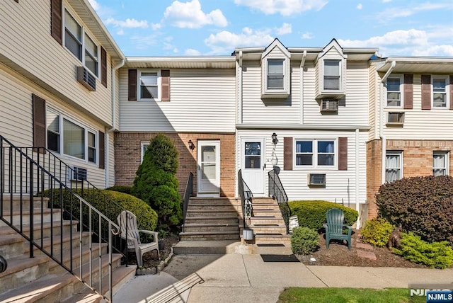multi unit property with brick siding and entry steps