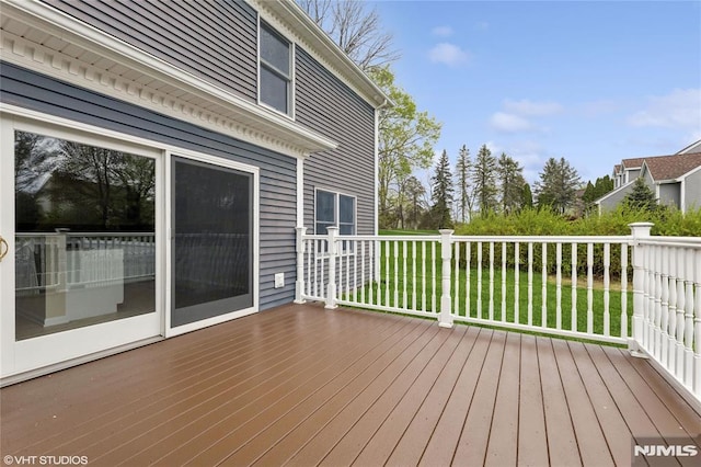 wooden deck with a yard