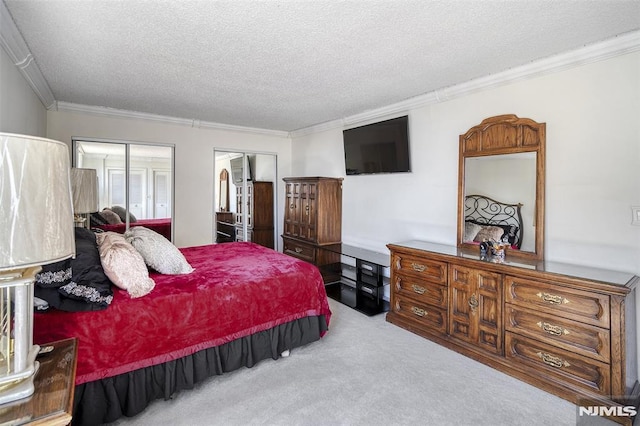 bedroom with carpet flooring, a textured ceiling, and ornamental molding