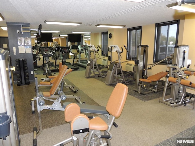gym with a textured ceiling
