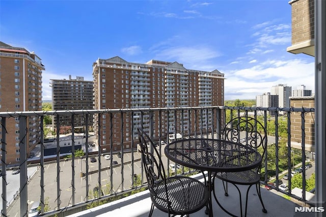 balcony featuring a city view