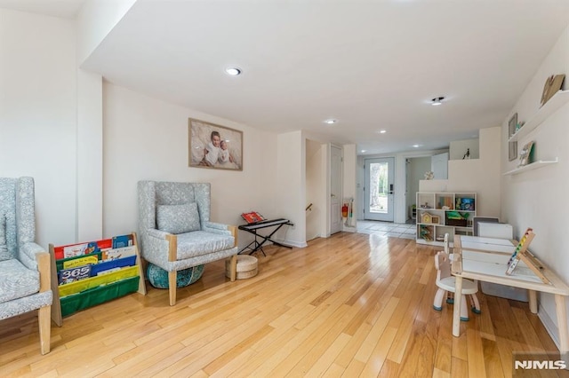 sitting room featuring recessed lighting and hardwood / wood-style floors
