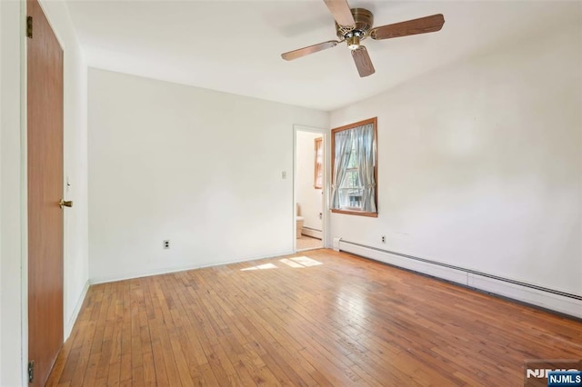 unfurnished room featuring light wood-type flooring, baseboards, ceiling fan, and a baseboard heating unit