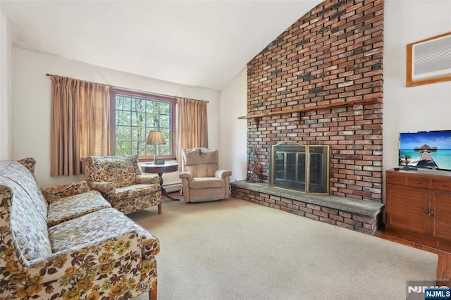 living room with a fireplace, carpet, and vaulted ceiling