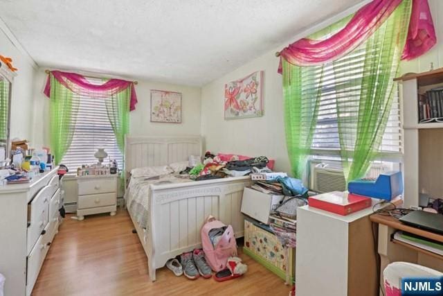 bedroom featuring light wood-style floors