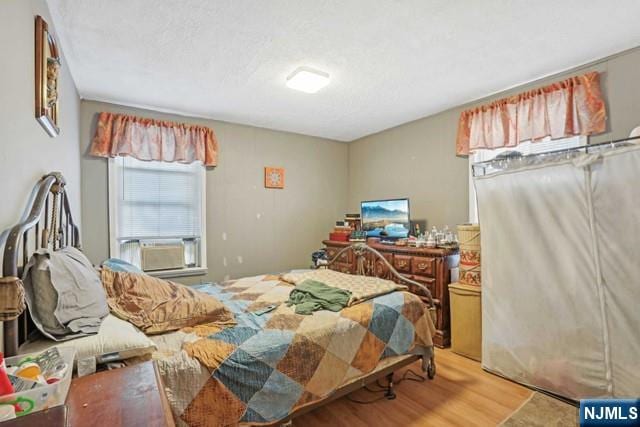bedroom featuring wood finished floors