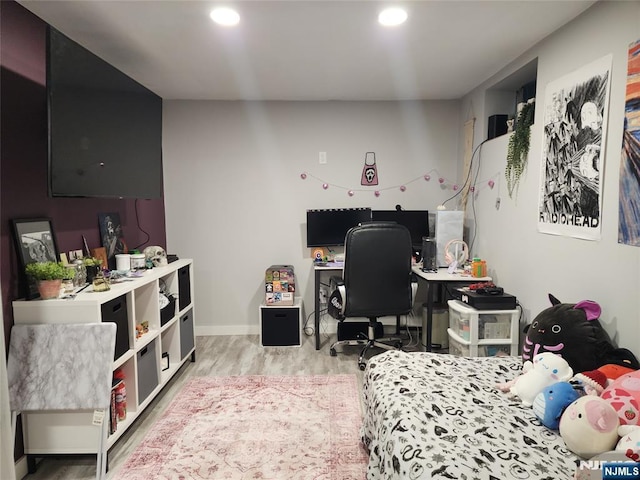 bedroom featuring wood finished floors, recessed lighting, an office area, and baseboards