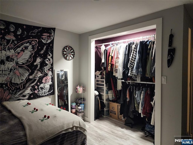bedroom with wood finished floors