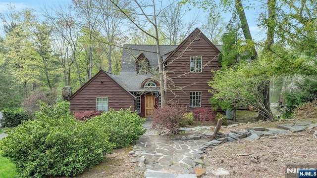 log cabin with roof with shingles