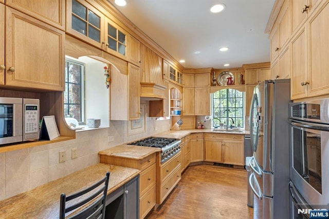kitchen with a sink, tasteful backsplash, stainless steel appliances, and recessed lighting
