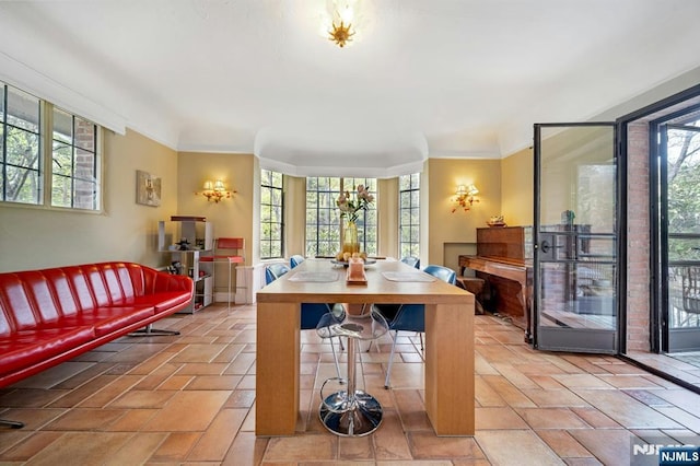 dining area featuring ornamental molding