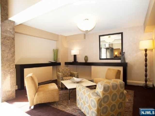 living area featuring baseboards