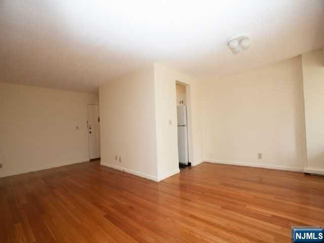 unfurnished room featuring wood finished floors