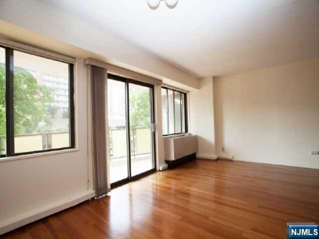 empty room with wood finished floors
