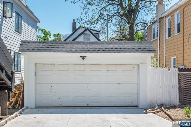 garage with fence
