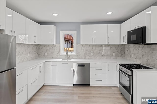 kitchen with white cabinets, recessed lighting, and appliances with stainless steel finishes
