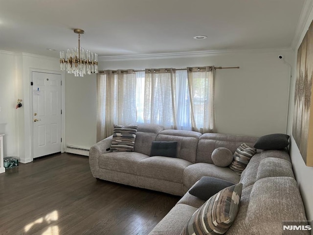 living area featuring crown molding, dark wood-type flooring, a notable chandelier, and baseboard heating