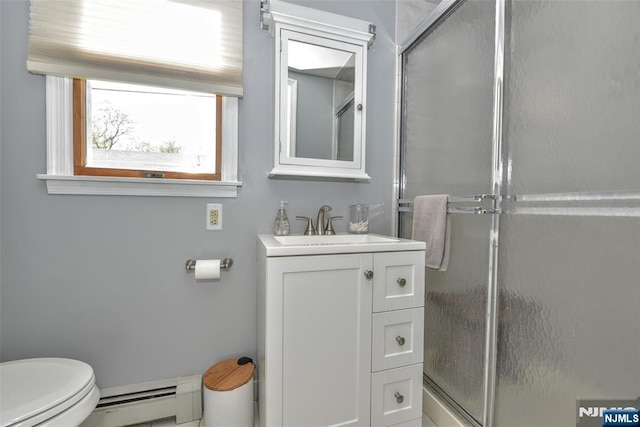 bathroom featuring vanity, a stall shower, a baseboard heating unit, and toilet