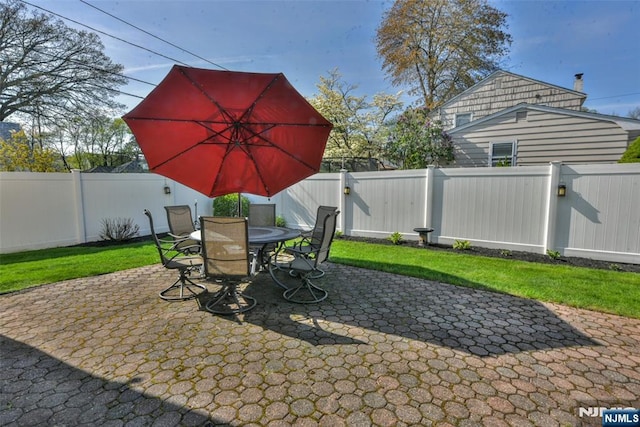 view of patio / terrace with a fenced backyard and outdoor dining space