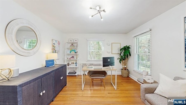 office with light wood-type flooring