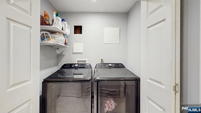 laundry room featuring separate washer and dryer