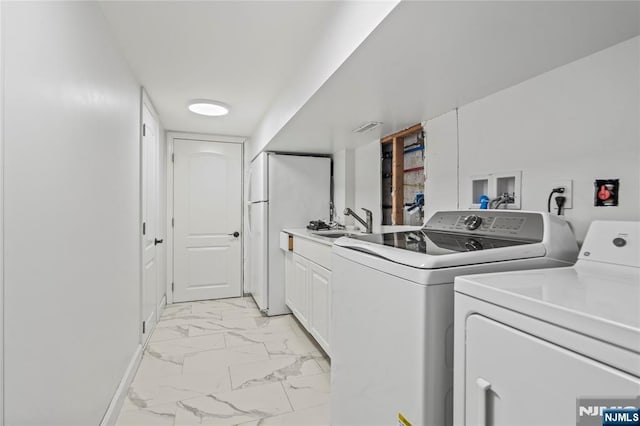 clothes washing area featuring independent washer and dryer, cabinet space, marble finish floor, a sink, and visible vents