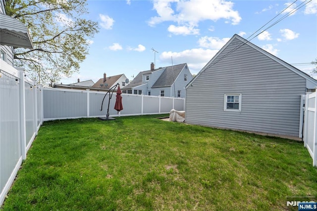 view of yard with a fenced backyard
