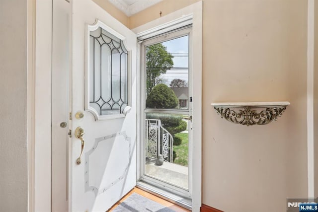doorway to outside featuring a healthy amount of sunlight