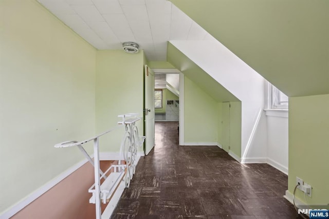 bonus room featuring baseboards