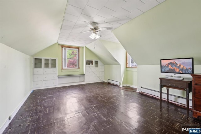 additional living space featuring lofted ceiling, a baseboard radiator, ceiling fan, a baseboard heating unit, and baseboards