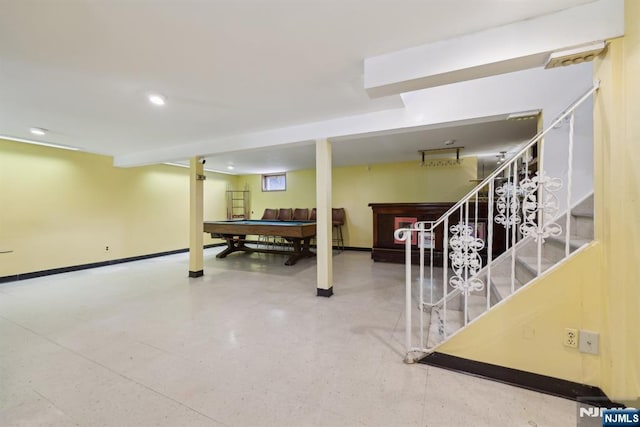 finished below grade area with baseboards, recessed lighting, stairway, and pool table