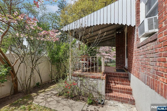 view of patio with fence and covered porch