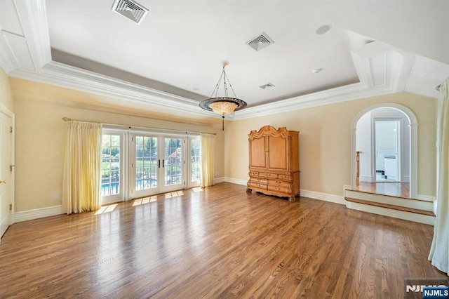 21 Birchwood, Old Tappan, NJ 07675 - unfurnished living room featuring a tray ceiling, ornamental molding, french doors, wood finished floors, and baseboards