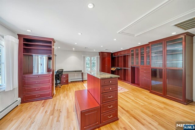 21 Birchwood, Old Tappan, NJ 07675 - kitchen featuring a baseboard radiator, dark brown cabinets, a desk, light wood-style floors, and recessed lighting