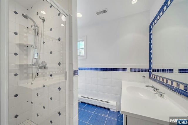 21 Birchwood, Old Tappan, NJ 07675 - full bathroom with a baseboard radiator, tile walls, a shower stall, vanity, and tile patterned flooring