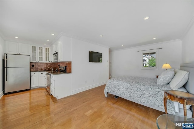 21 Birchwood, Old Tappan, NJ 07675 - bedroom featuring freestanding refrigerator, crown molding, light wood-style flooring, baseboards, and recessed lighting