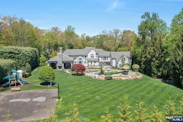 21 Birchwood, Old Tappan, NJ 07675 - back of house featuring a playground and a yard
