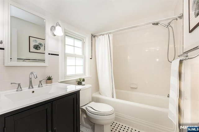 bathroom with toilet, shower / bath combination with curtain, and vanity