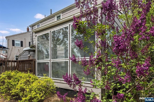 view of home's exterior featuring fence