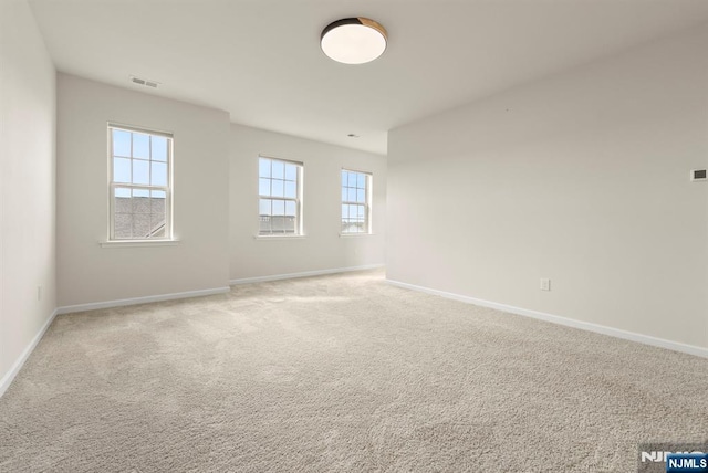 4 Arnold Dr, Wood Ridge, NJ 07075 - spare room featuring baseboards, light colored carpet, and visible vents