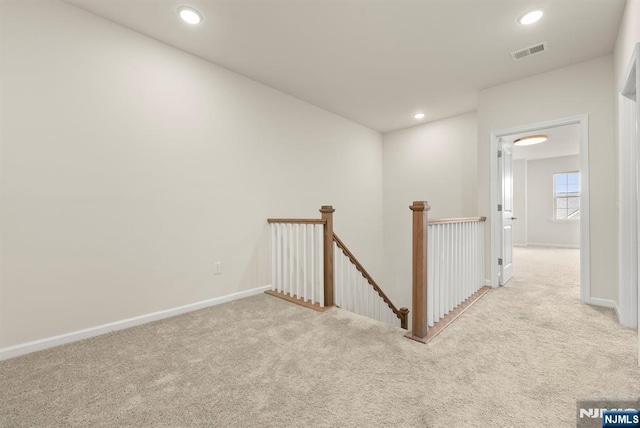 4 Arnold Dr, Wood Ridge, NJ 07075 - hall featuring visible vents, carpet, baseboards, and an upstairs landing