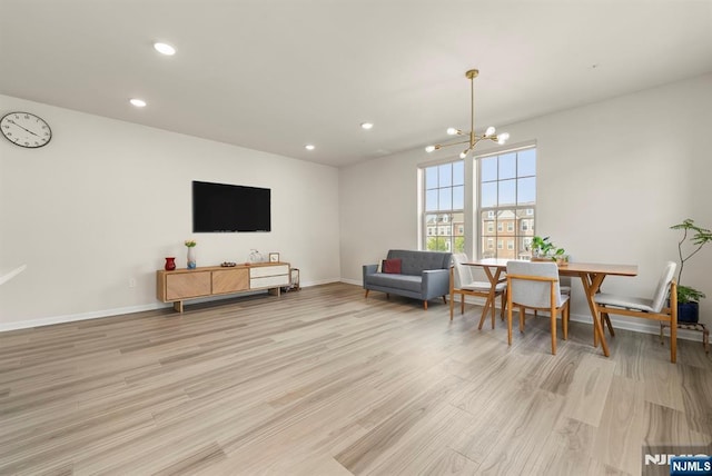 4 Arnold Dr, Wood Ridge, NJ 07075 - living area with recessed lighting, baseboards, an inviting chandelier, and light wood-type flooring